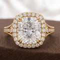 Close-up macro image highlighting the brilliant cushion cut lab diamond, double prongs, and halo accents.