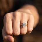 On-hand view of a 3 ct marquise lab diamond engagement ring in 14k yellow gold with vintage detail.