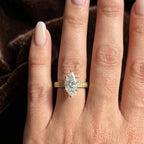 Direct view of 3 carat marquise diamond ring on finger highlighting the elongating shape and scroll engraved band.