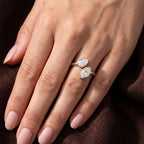 Full hand wearing a two stone pear and marquise lab grown diamond open cuff ring.