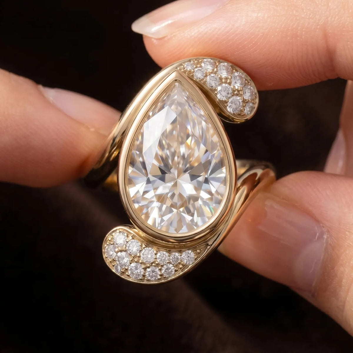 Macro photograph showing brilliance of 3 CT pear lab diamond and pavé swirl accents.