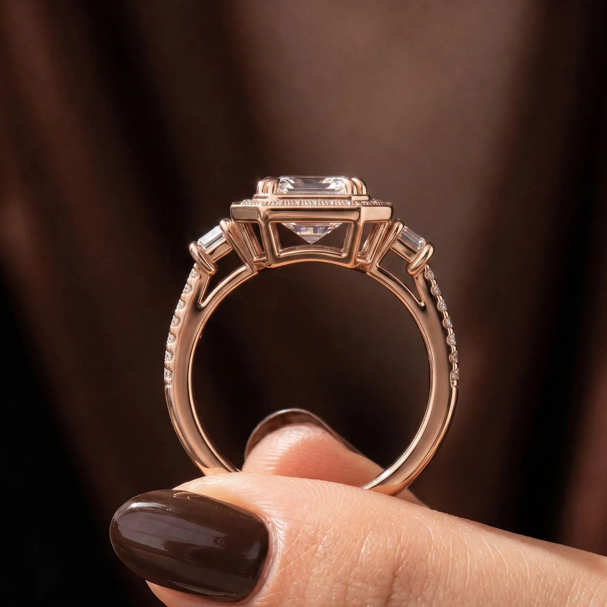 Direct side gallery view showing the setting and structure of rose gold emerald cut lab diamond ring.