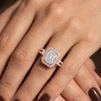 Elegant pose demonstrating a rose gold 3 CT emerald cut lab grown diamond engagement ring on hand.