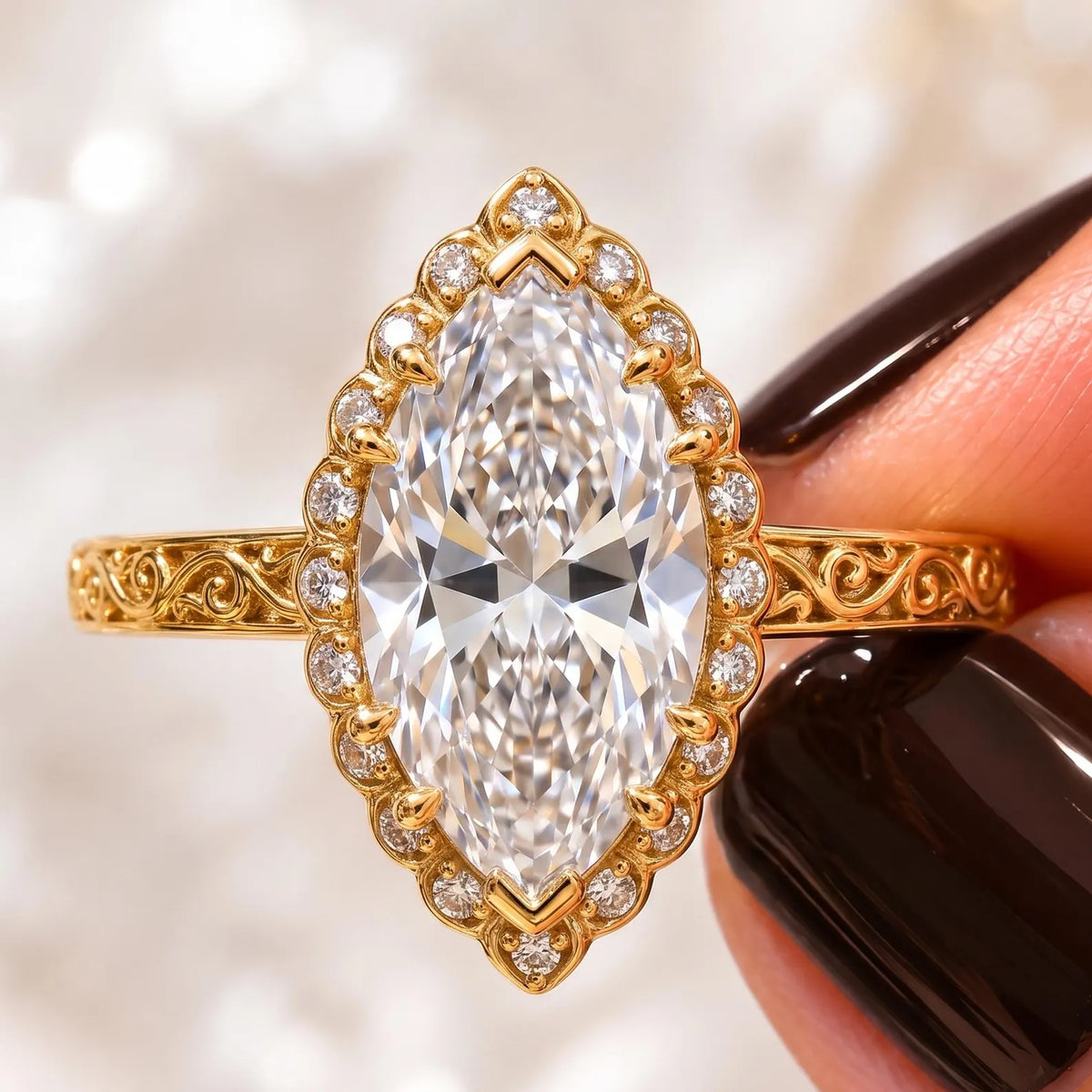Close-up top view of a 3 CT marquise lab grown diamond engagement ring with scalloped halo and yellow gold filigree scrollwork band.