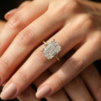 Perspective view of a large 4ct emerald cut lab-created diamond solitaire ring on hand.