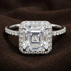 Studio macro shot of 3 CT Asscher cut lab grown diamond halo ring in white gold or platinum setting option.