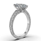 Side perspective view of a 3 carat marquise cut lab grown diamond ring in white gold with vintage scrollwork engraving.
