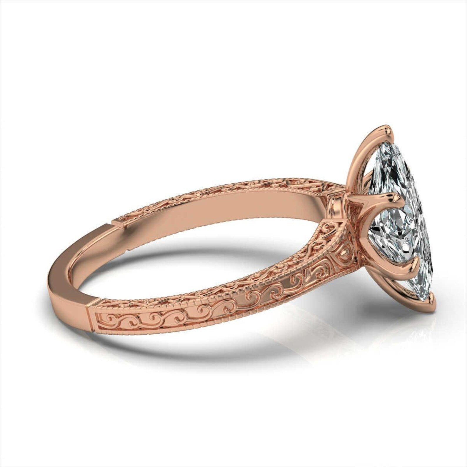 Side profile view of a rose gold antique-style engagement ring featuring a 3ct marquise cut lab diamond.