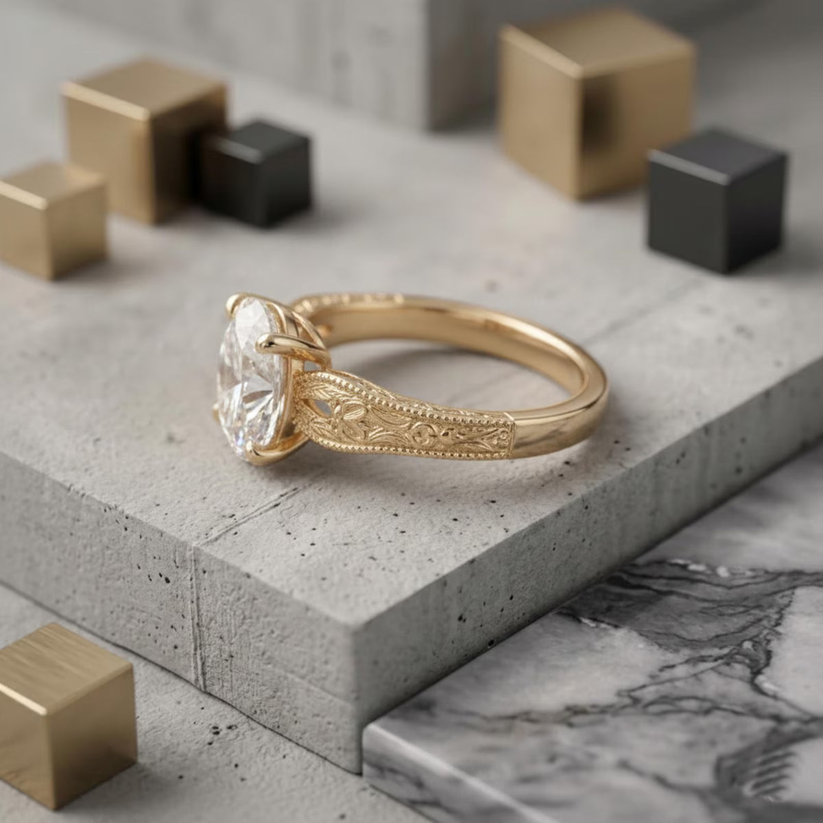 Side angle perspective of a 2 CT oval cut lab grown diamond engagement ring with vintage floral filigree band on gray block display.
