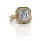 Close-up top perspective of a 3 carat Asscher cut lab diamond halo engagement ring in polished yellow gold.