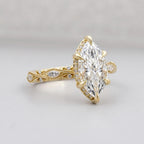Perspective view of a 3 CT marquise lab grown diamond ring showcasing the hidden halo setting and intricate filigree shank.