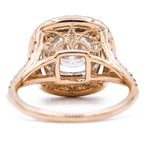 Underside view displaying intricate vintage filigree scrollwork underneath the double halo basket setting.