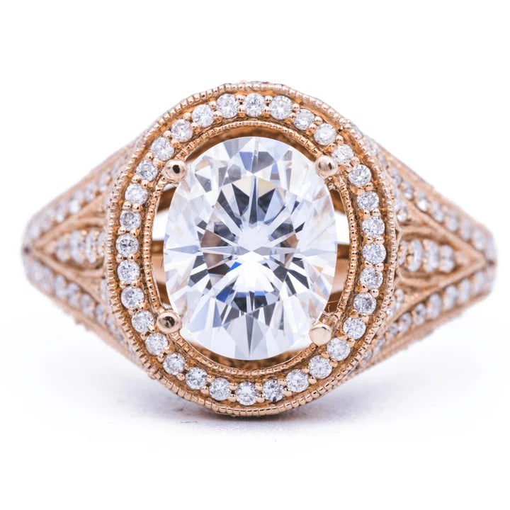 Top-down view of a 3 CT oval cut lab grown diamond engagement ring with milgrain pave halo in rose gold.