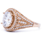Perspective shot displaying the wide filigree and pave diamond shoulder of a 3ct oval lab diamond ring.