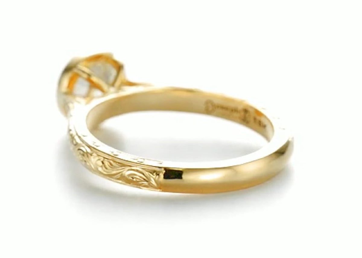 Bottom shank view showing transition from intricate hand engraving to a smooth yellow gold comfort band.