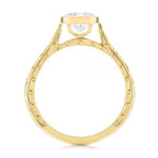 High-definition side profile of bezel-set round diamond ring with cathedral basket gallery.