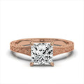 Front view of 2 CT princess cut lab grown diamond solitaire engagement ring in rose gold with vintage filigree band.
