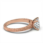 Side profile of rose gold princess cut lab diamond ring showing intricate scrollwork filigree and milgrain engraving.