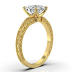 Angled view of yellow gold 2ct princess cut lab diamond ring showcasing the 4-prong setting and side engraving.