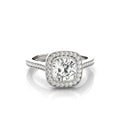 Front view of a 3 CT cushion cut lab grown diamond engagement ring with a vintage milgrain halo setting in white gold.