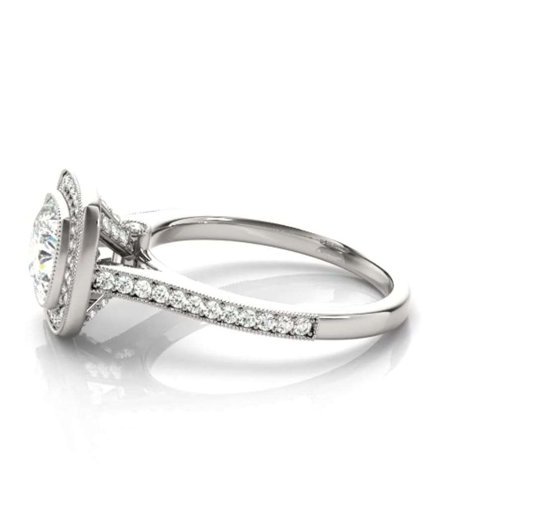 Side view of the white gold ring featuring cathedral arches and delicate milgrain pavé edging along the shank.
