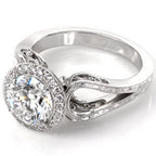 Three-quarter view of a 3 CT round lab grown diamond engagement ring with vintage filigree band and milgrain halo in white gold.