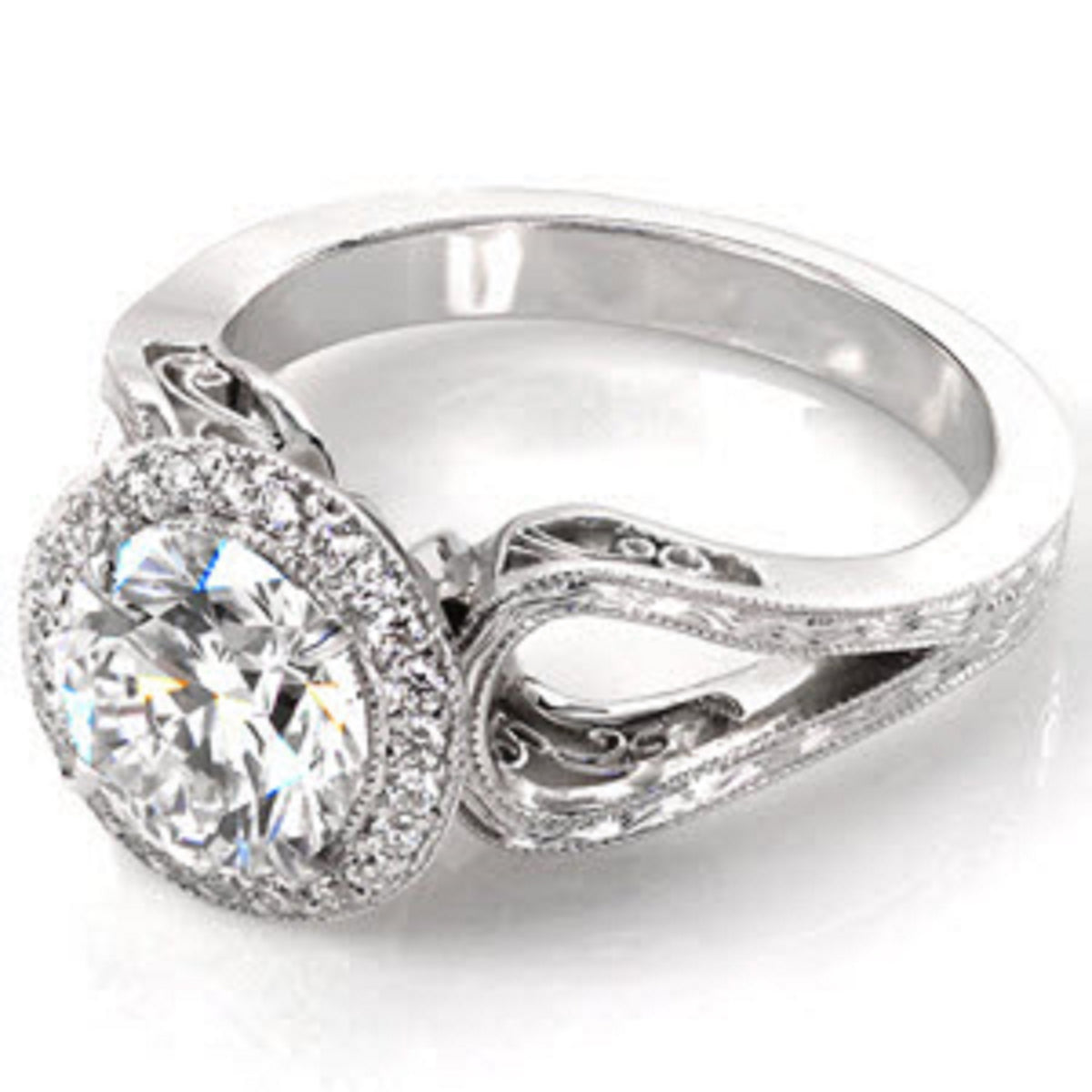 Three-quarter view of a 3 CT round lab grown diamond engagement ring with vintage filigree band and milgrain halo in white gold.