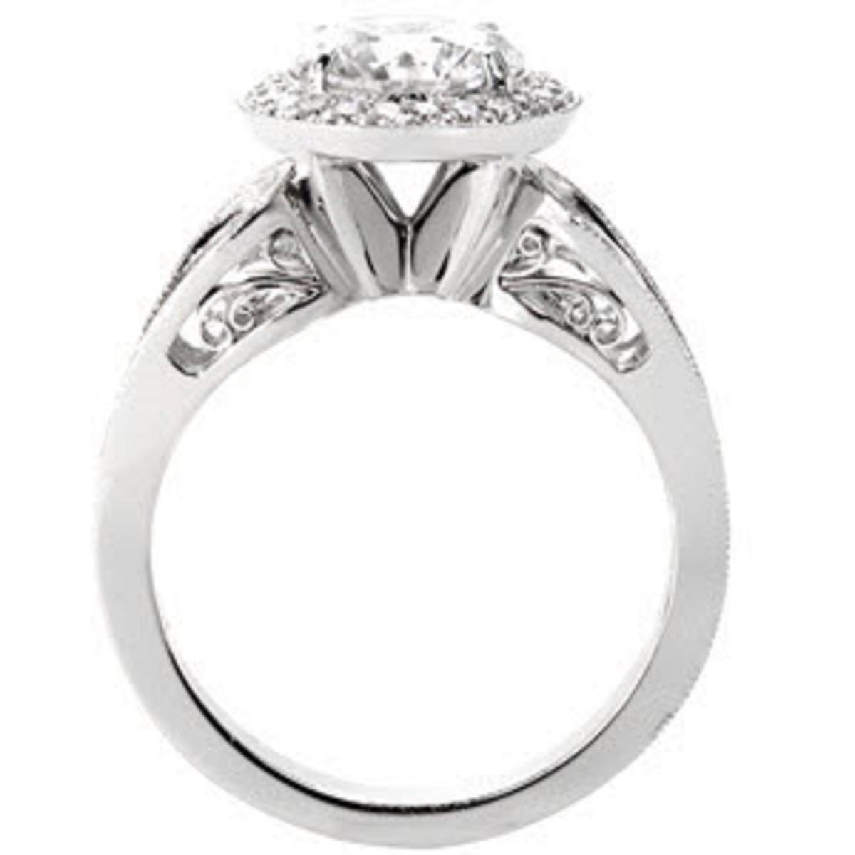 Profile side view highlighting the cathedral bridge, filigree under-gallery scrollwork, and white gold shank.