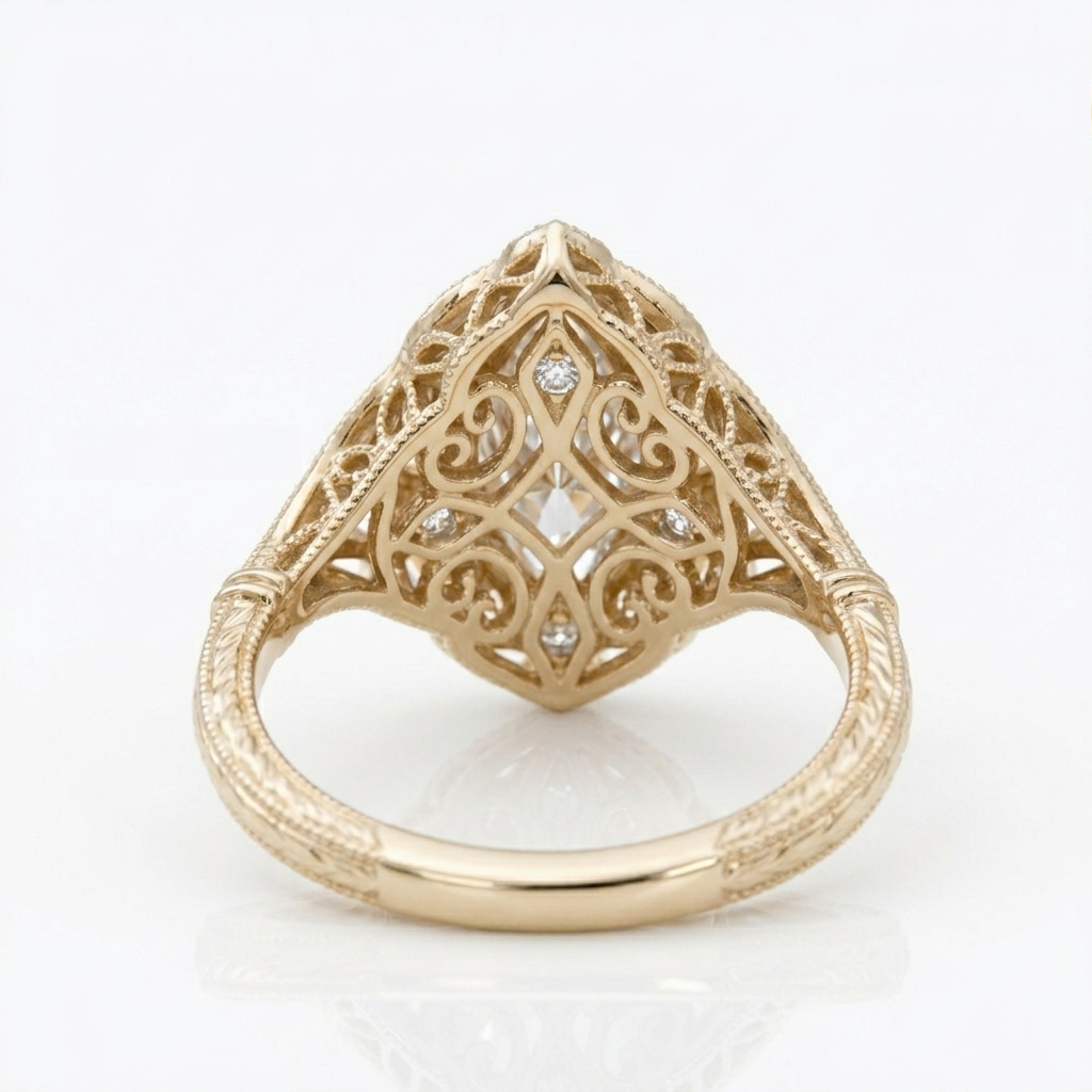 Underside view showing intricate gold filigree undergallery and micro-set accent diamonds on a 3 ct marquise lab diamond ring.