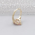 Side profile view of a 3 CT pink marquise lab grown diamond ring showcasing the vintage hand-engraved scrollwork band.