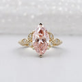 Front view of a 3 carat fancy pink marquise lab grown diamond in a yellow gold vintage floral setting.