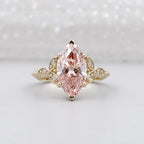 Front view of a 3 carat fancy pink marquise lab grown diamond in a yellow gold vintage floral setting.