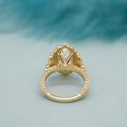Bottom perspective showcasing the detailed filigree undergallery and engraved band of a 4 CT marquise ring.