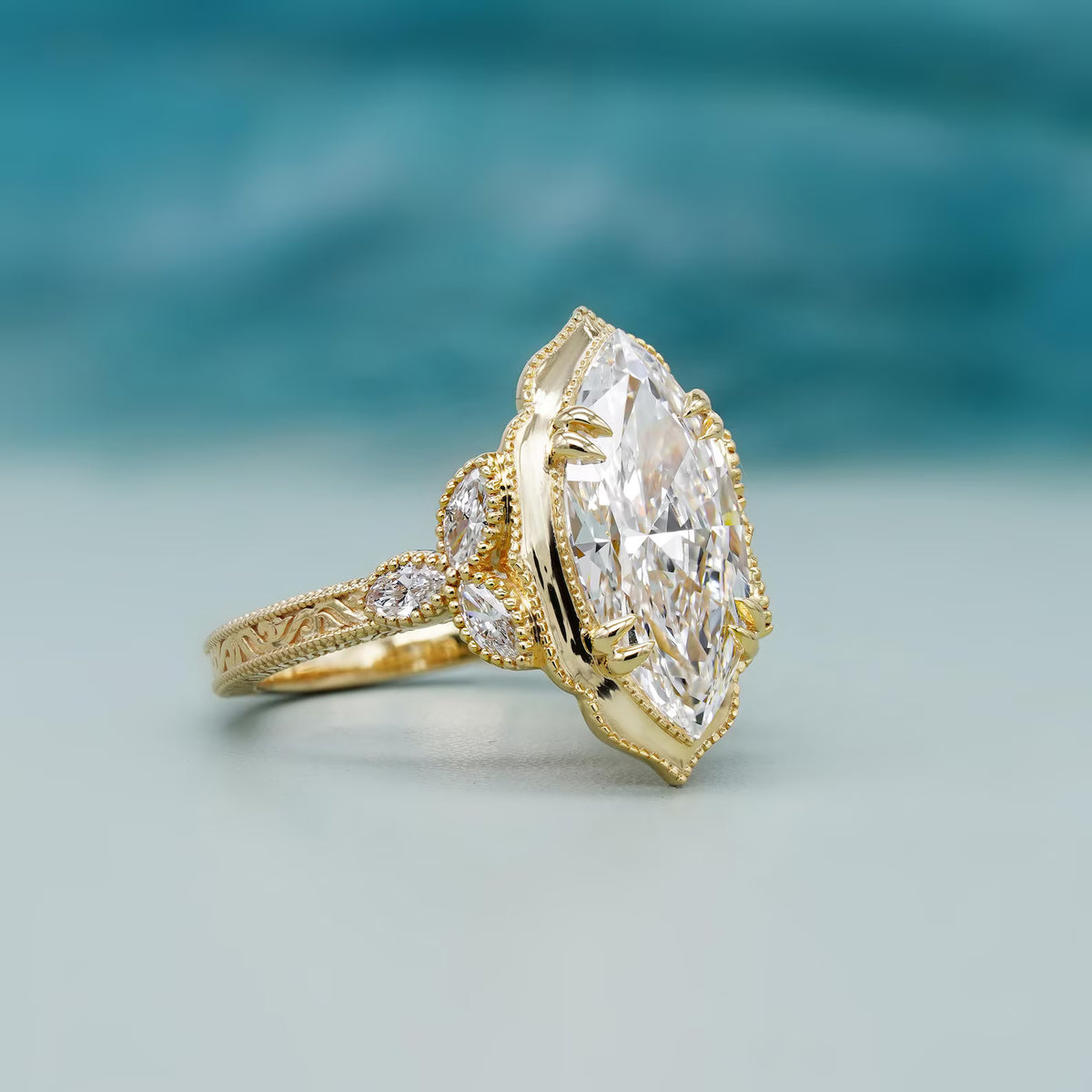 Angled macro studio shot highlighting claw prongs and marquise cluster accents on yellow gold band.