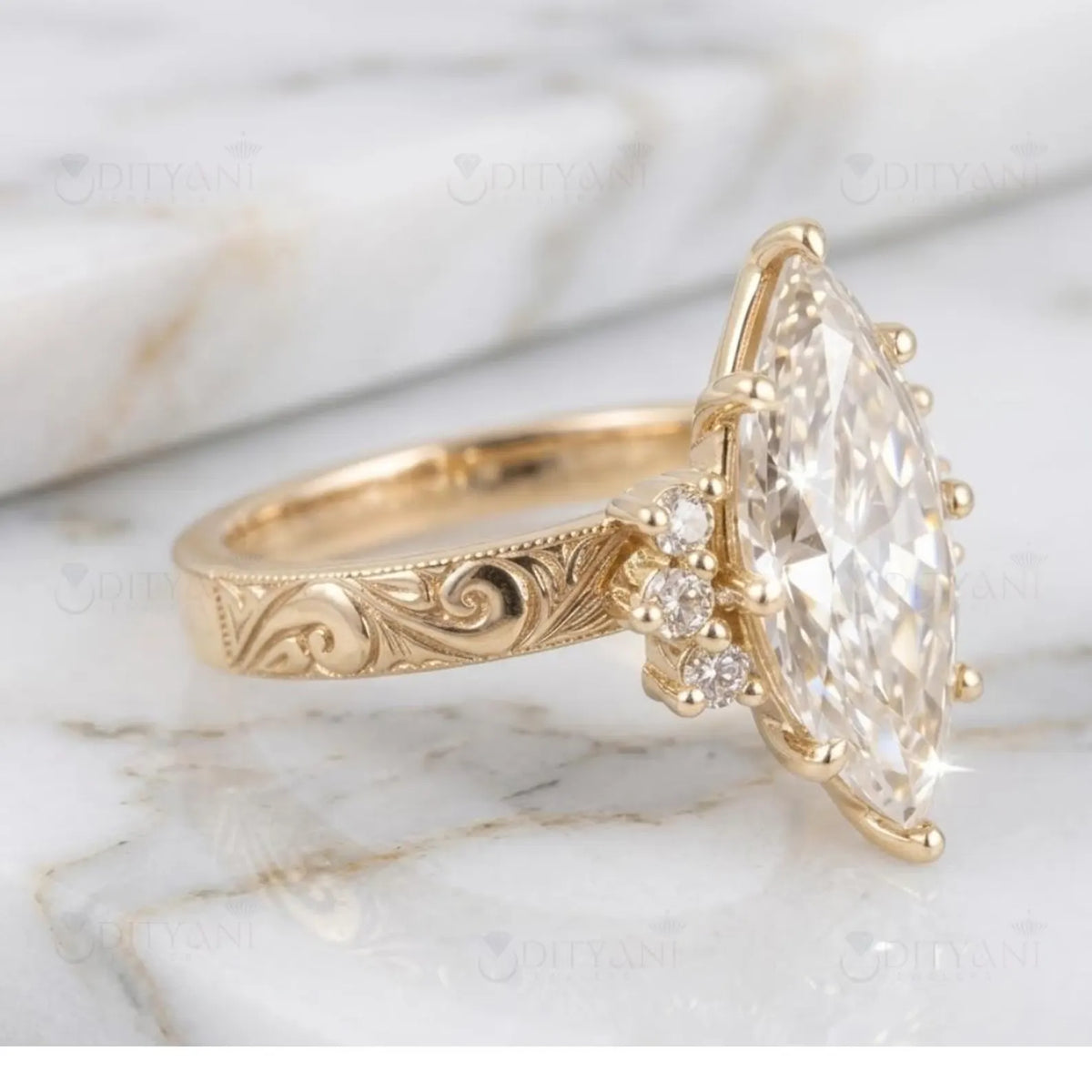 Side angle view of 4 carat marquise cut lab grown diamond ring featuring vintage scroll engraving on yellow gold band.