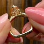 Bottom perspective showcasing the carved floral under-gallery basket and euro-shank bottom on a yellow gold ring.