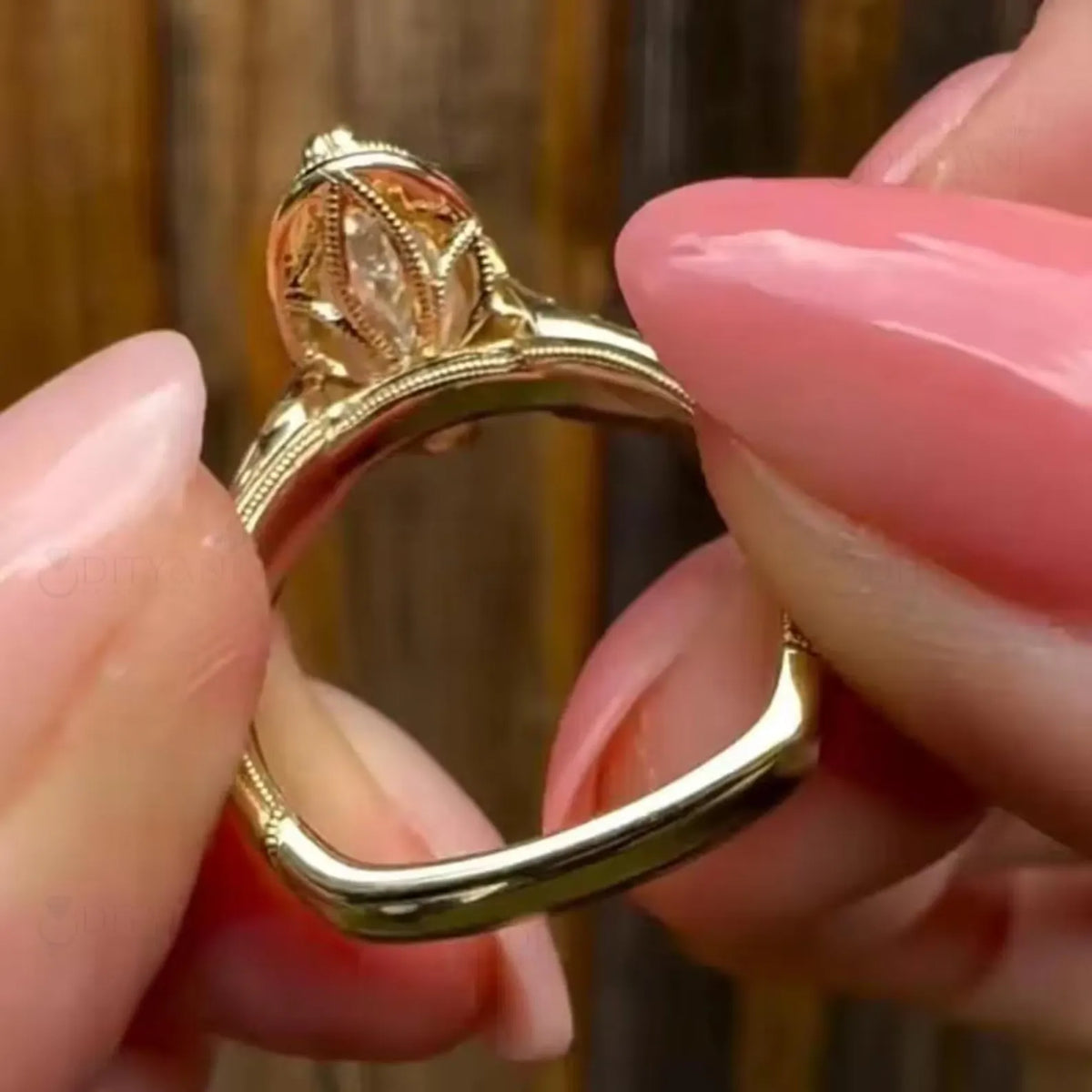Bottom perspective showcasing the carved floral under-gallery basket and euro-shank bottom on a yellow gold ring.