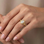 Lifestyle view of hands crossed wearing vintage-inspired 2 CT oval lab diamond bezel ring.