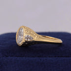 Angled side profile showing chiseled bezel rim and textured band of 3 CT oval lab diamond ring.