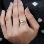 On-hand view of a 2 carat cushion cut lab grown diamond engagement ring with split shank in gold.