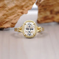Front top-down view of a 2 CT elongated cushion cut lab-grown diamond ring framed by a pave bezel halo.