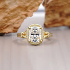 Front top-down view of a 2 CT elongated cushion cut lab-grown diamond ring framed by a pave bezel halo.
