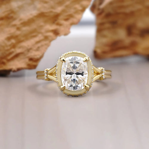 Front top-down view of a 2 CT elongated cushion cut lab-grown diamond ring framed by a pave bezel halo.