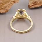 Under-gallery view showing the polished inner band and structural setting of a cushion cut lab diamond ring.