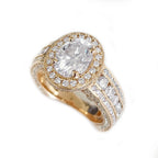 Angled top view showcasing a 2 carat oval lab diamond framed by a brilliant diamond halo and wide channel band.