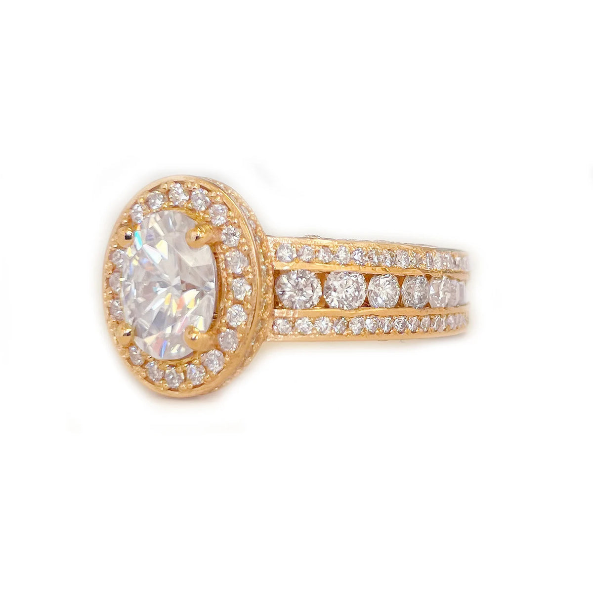Close-up front perspective of a 2 CT oval lab diamond ring highlighting maximum sparkle across the triple-row band.
