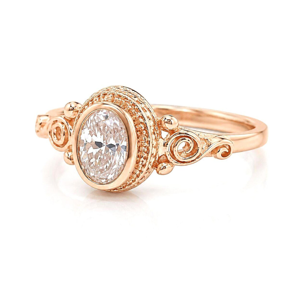 Front view of a 2 CT oval cut pink lab grown diamond ring in a rose gold vintage filigree bezel setting.