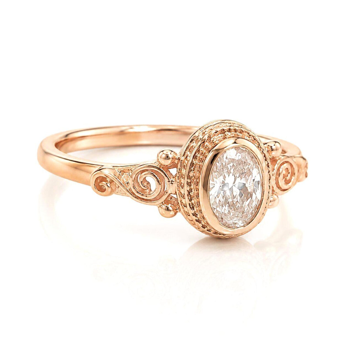 Angled perspective of a 2 carat pink oval lab created diamond ring with milgrain textured bezel.