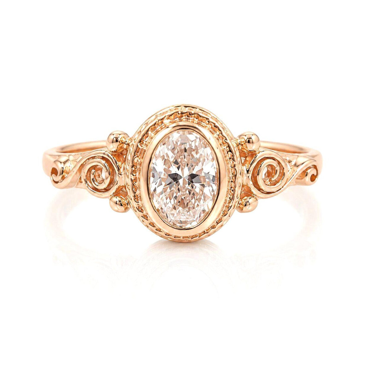 Overhead top-down view showing the sparkling 2 CT pink oval diamond surrounded by rose gold beaded bezel detailing.