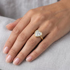 Full hand perspective of a minimalist 3 carat heart cut lab diamond bezel engagement ring.